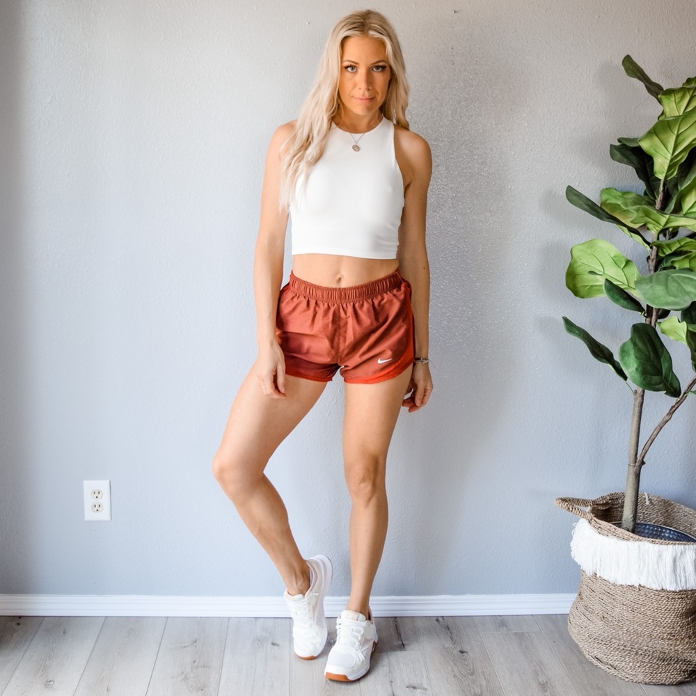Burnt orange Nike running shorts